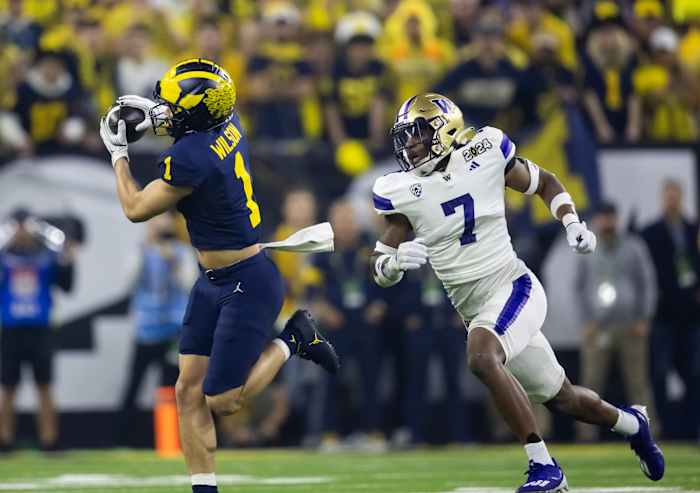 Jan 8, 2024; Houston, TX, USA; Michigan Wolverines wide receiver Roman Wilson (1) against Washington Huskies defensive back Dominique Hampton (7) during the 2024 College Football Playoff national championship game at NRG Stadium. Mandatory Credit: Mark J. Rebilas-USA TODAY Sports